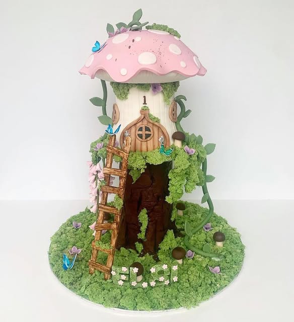 A hand-sculpted fairytale mushroom cottage cake by Something Sweet