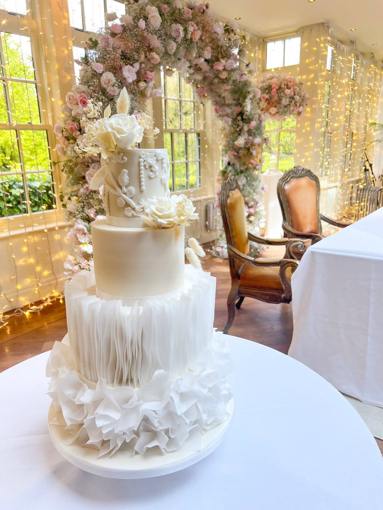 An elegant hand-sculpted wedding cake by Something Sweet